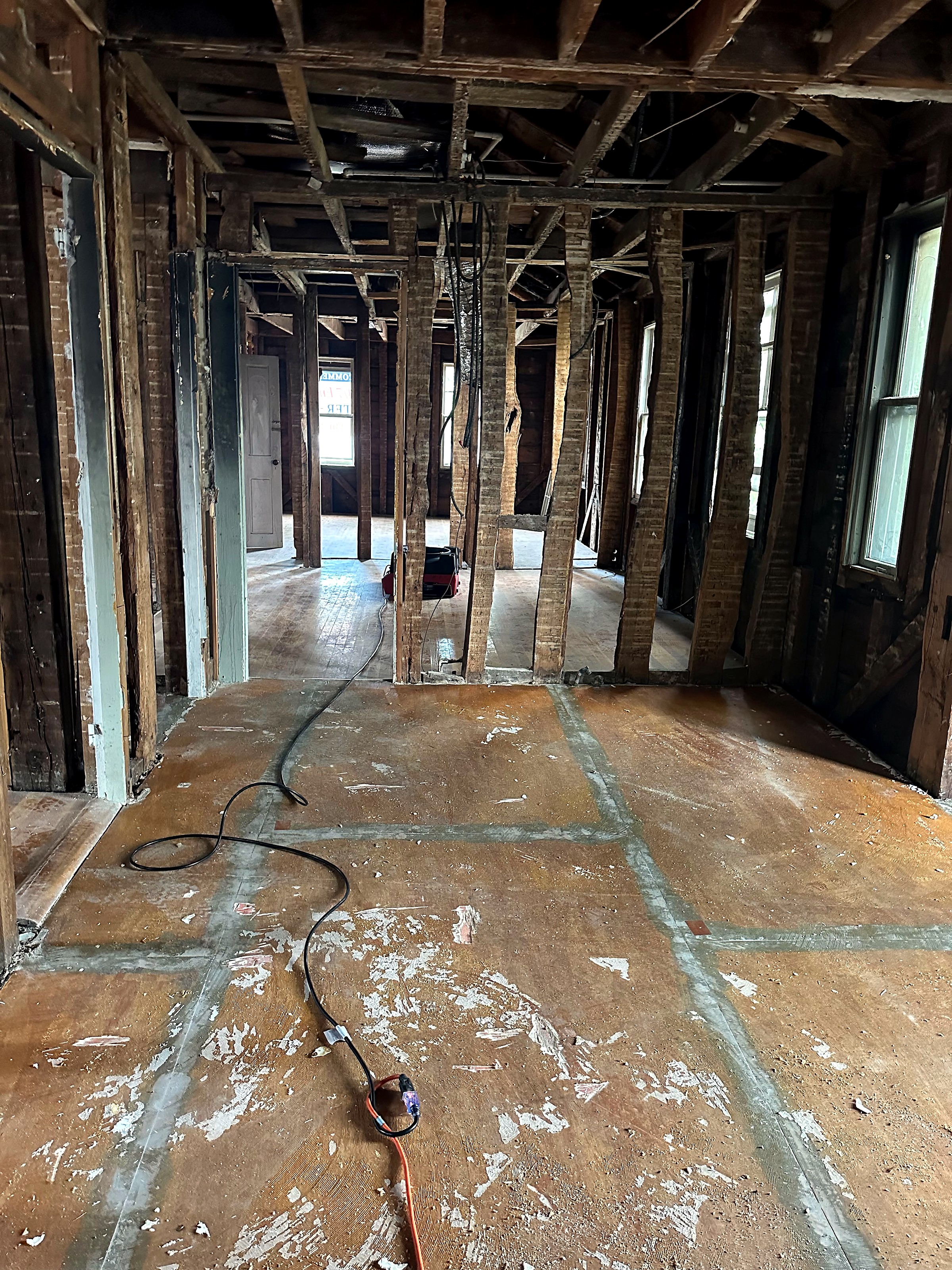A building interior taken down to its framing during reconstruction.